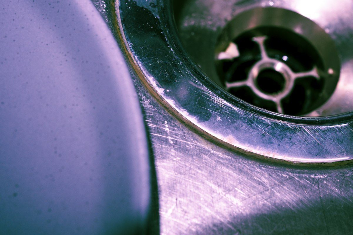 Close-up of a stainless steel kitchen sink drain