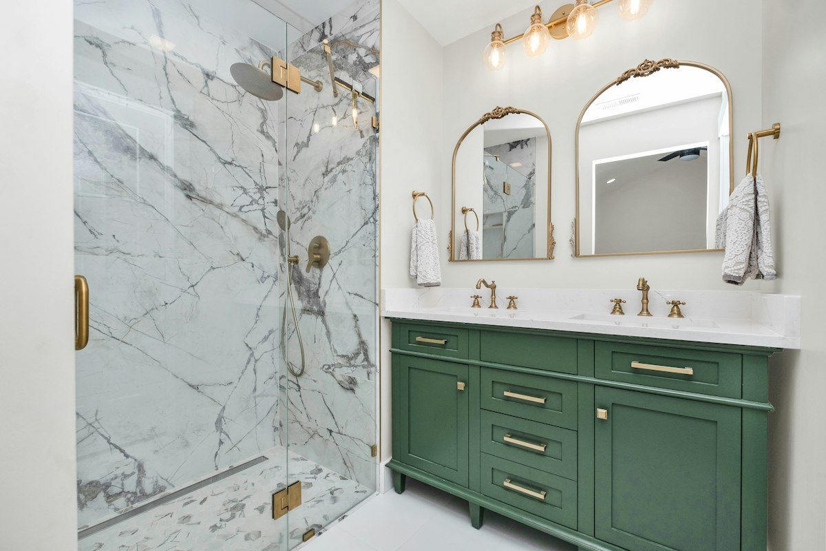 Newly remodeled bathroom with a glass shower and double vanity